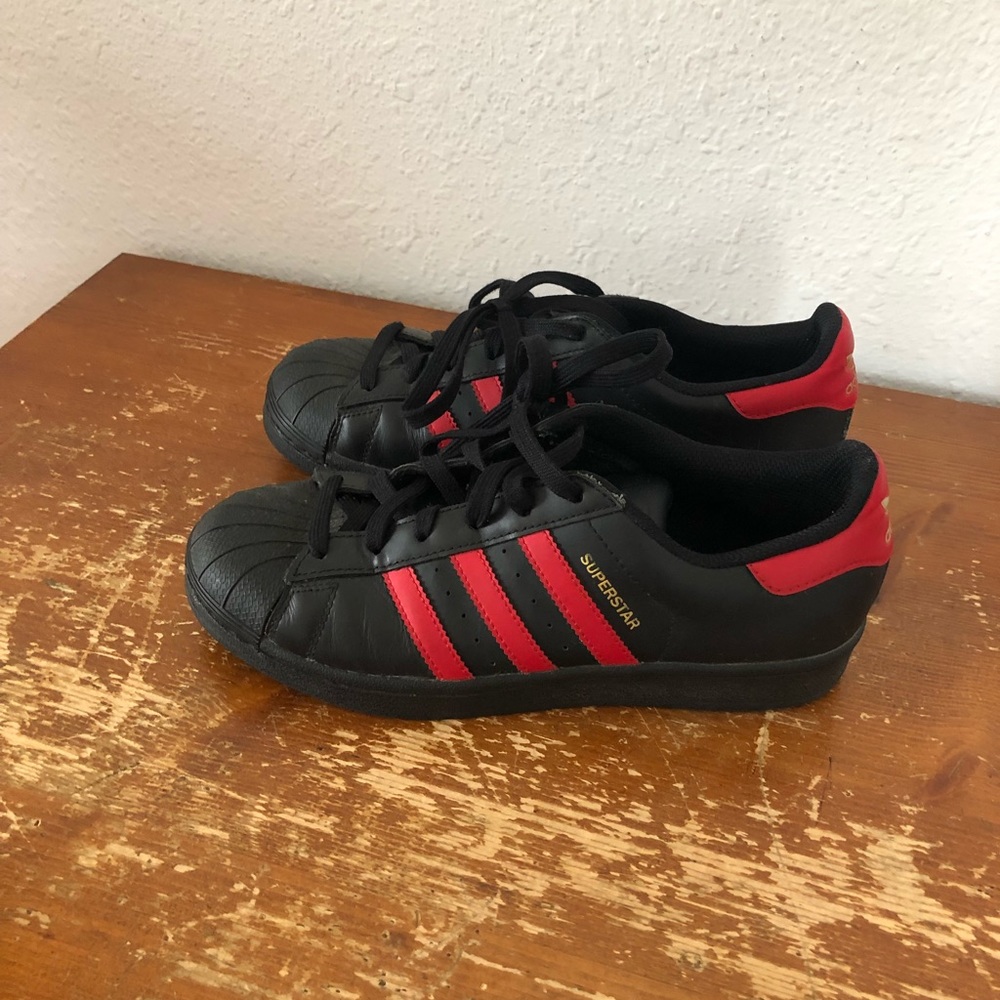 Adidas black and red striped superstars